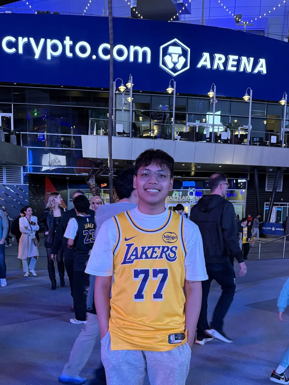 Pio outside Crypto.com Arena wearing a Lakers jersey